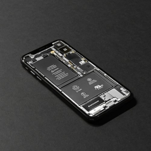 High-resolution image of a smartphone showcasing its internal components on a dark surface.